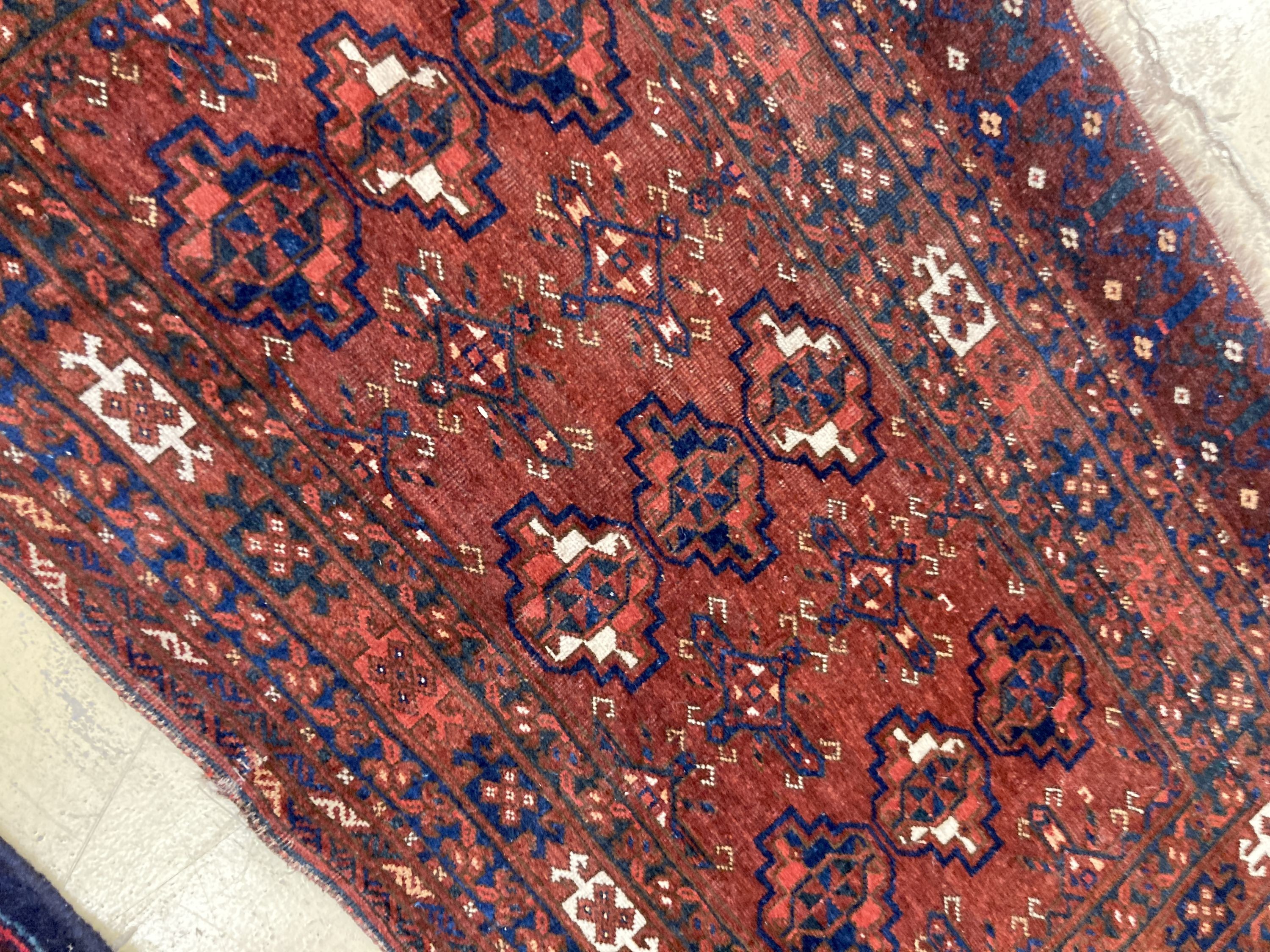An antique Tekke burgundy ground rug, 150 x 92cm